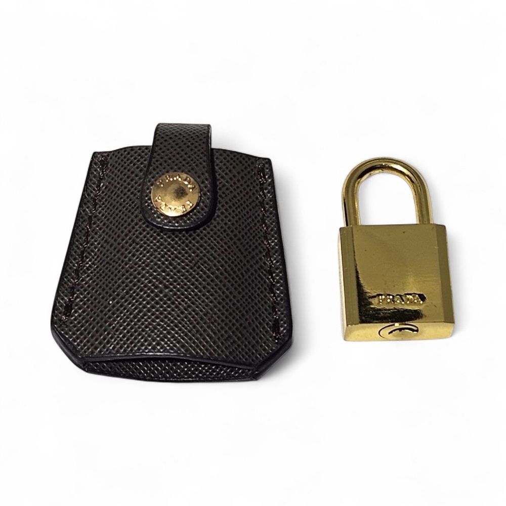 Prada gold lock with brown clochette
